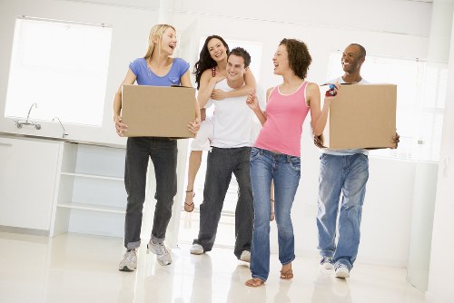 Professional removals man loading a van with furniture