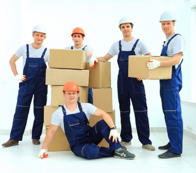 Removalist loading items into a moving truck