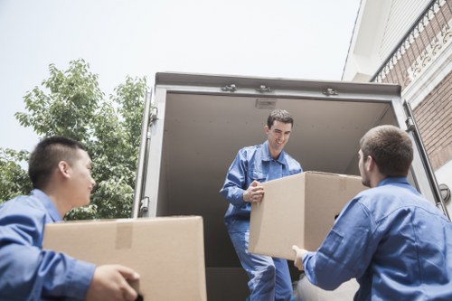 Removalist team efficiently loading a moving truck