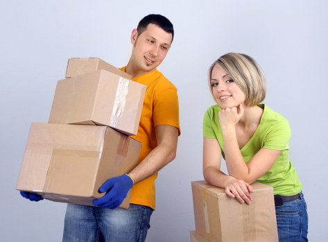 Professional movers handling household items