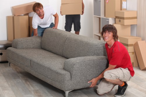 Trained removalists loading items into a truck