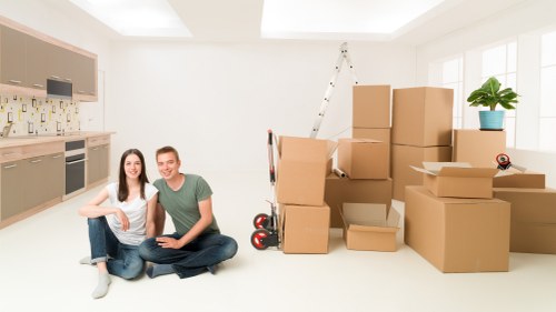 Removalists efficiently packing and handling belongings